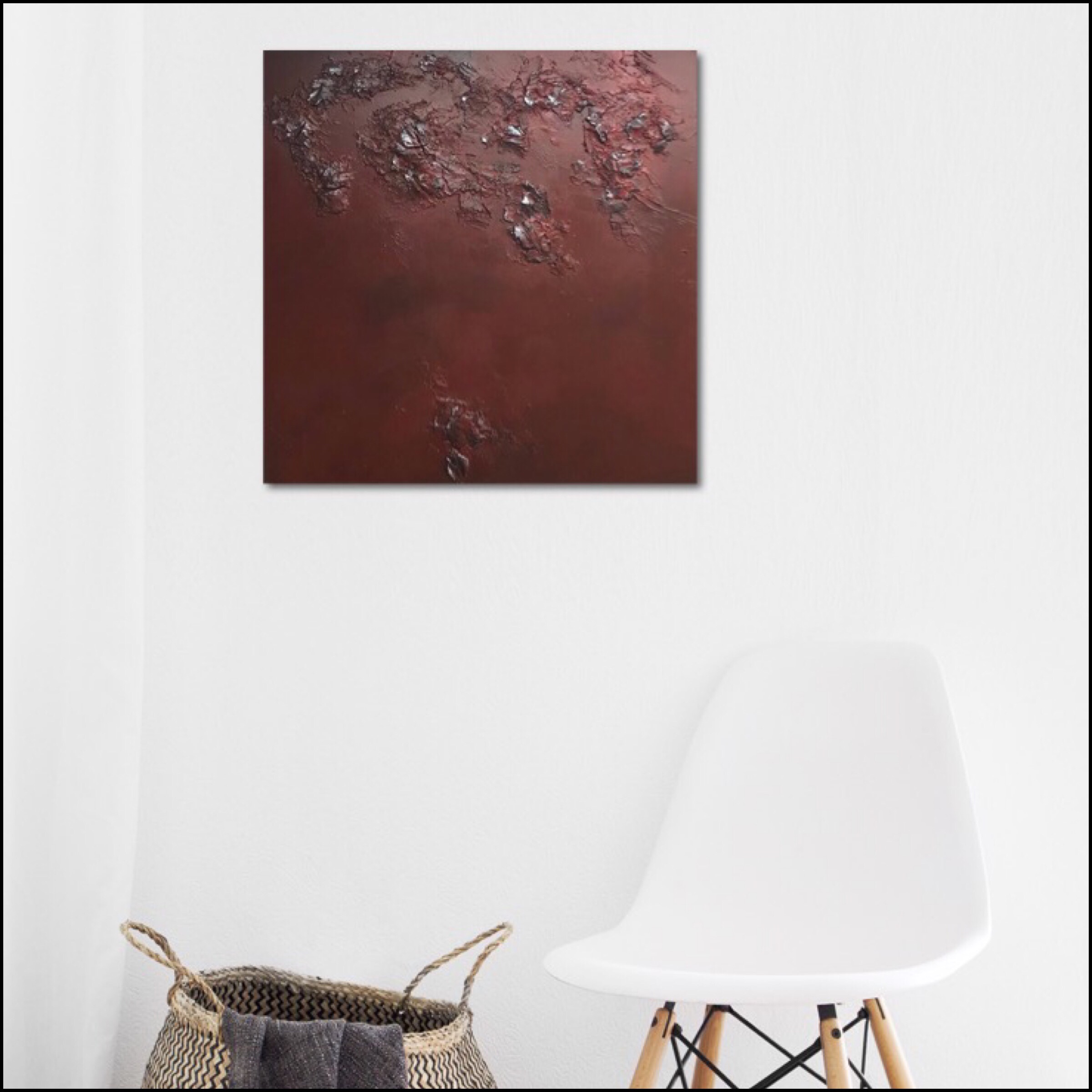 Textured abstract painting in red and a touch of silver